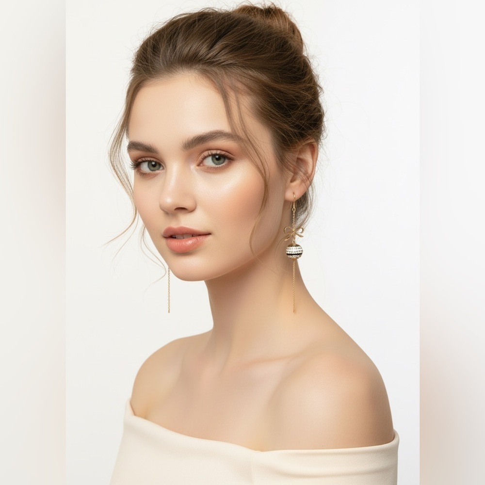 ✨ "Glamour in every sway — gold bow drop earrings add elegance to any outfit!" 💫